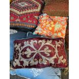 Collection of vintage feather filled cushions, includes various tapestry worked cushions.