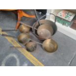 Collection of antique brass pots and jelly pan etc .