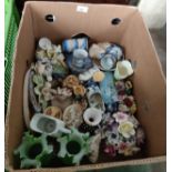 A box full of porcelain, coloured glass and fine bone china