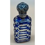 Antique facet cut perfume bottle, Blue overlay and mercury design. Fitted with silver ornate lid and