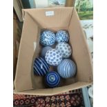 Box of blue and white decorative display balls .