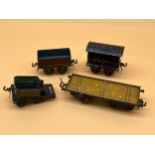Four antique Bing tin plate train wagons and carriage.