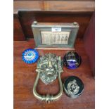 Antique desk callendar , brass lion old door knocker together with 3 paperweights .