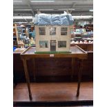 Vintage dolls house together with vintage folding table .