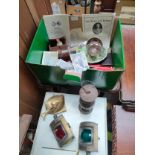 A box of collectables to include brass ship lighting etc