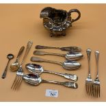 Collection of antique silver flatwares and cream jug. Includes Victorian London silver cream jug