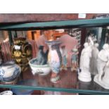 Shelf of collectables includes Parian ware lady figures, russian art ware vase etc .