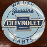 Vintage Chevrolet enamel car advertising sign. 'We Use Genuine Chevrolet Part' produced by Chevrolet