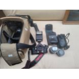 Pentax ME Super camera together with spare lenses and bag etc .