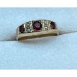 Chester 9ct gold ring set with single garnet, two amethyst and seed pearls. [Ring size P] [2.