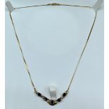 9ct yellow gold, sapphire and diamond evening necklace. [4.60Grams]