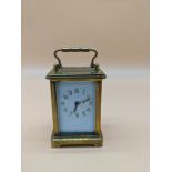 Antique French brass carriage clock with single drum movement, within case