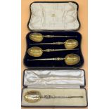 Five boxed Birmingham silver gilt anointing spoons. [572grams] [25cm in length]