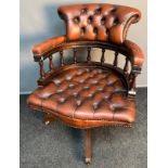 Reproduction Antique style Chesterfield captain's chair.