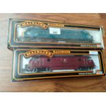 2Boxed mainline diesel locomotive s both boxed .