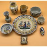 Quantity of Quimper tin glaze items includes bowls, mugs and plate.