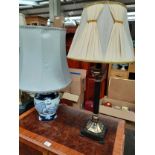 Contemporary Corinthian column table lamp together with oriental blue and white table lamp.