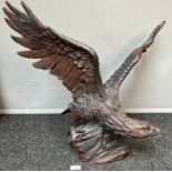 A Large Bronze eagle sculpture signed Houstin. [54x70x43cm]