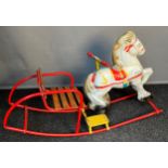 Vintage Child's tin plate rocking horse. Fitted with wooden slat seat.
