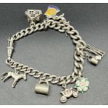 Silver curb bracelet with various silver charms [46.44grams]