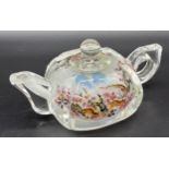 A Chinese reverse painted glass teapot, depicting scenes of snakes. [6.5cm high x 14cm in length]