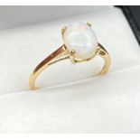 10ct yellow gold ladies ring set with a single oval opal stone. [Ring size R] [1.71GRAMS]