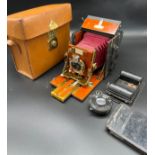 Antique 'The Sanderson' red bellow camera, extra lens and carry bag. Mahogany wood and brass