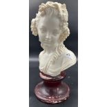 A large girl bust detailed with grapes and vine within her hair. Sat upon a marble base. [44cm high]