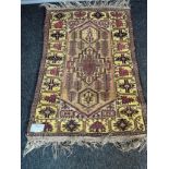 Hand woven prayer rug. Label to the back- Out of the Nomads Tent. Origin: Waziri Prayer Rug, Size: