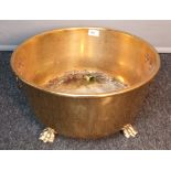 Antique gilt brass plant pot stand, detailed with lion head and ring handles, raised on claw