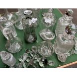 A Collection of cut crystal and glass decanters include two pinched decanters. The lot also includes