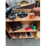 Selection of camera items to include Praktica camera, Binoculars, kodak bellow camera and ink well