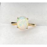 10ct yellow gold ladies ring set with a single oval cut opal stone. [Ring size S] [1.83Grams]