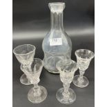 19th century decanter with four facet cut drinking glasses.