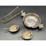 Pair of Birmingham silver shell salt pots with small silver ladles, Ornate Silver sugar tongs and