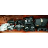 Shelf of Camera a to include fujica , binoculars includes Miranda etc