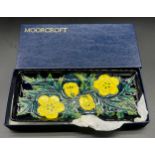 Boxed Moorcroft pen tray, Tube line yellow flower design with blue ground. [20x9cm]