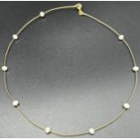 9ct yellow gold wire choker necklace fitted with pearls. [2.56grams]
