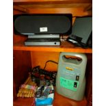 2 shelf of miscellaneous includes docking station s , music instruments etc