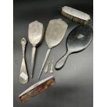 Lot of silver dressing table items to include brush, hand mirror, button hooks and ebony hand