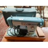 Brothers sewing machine in fitted case with pedal