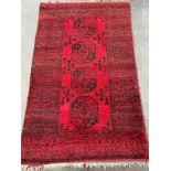 Antique hand woven Indian/ Persian red and black ground rug. [193x120cm]