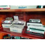 Shelf of boxed Eddie stobart model trucks etc