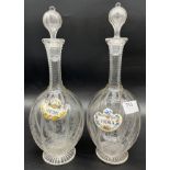A Pair of late 19th century facet cut and etched crystal decanters with stoppers and enamel drinks