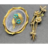 Edwardian 9ct yellow gold flower and swallow brooch designed with seed pearls and green glass