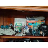 Large shelf of star war toys includes millennium falcon , R2d2 etc