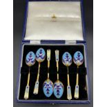 Boxed set of six gilt metal and enamelled tea spoons.