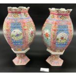 A Pair of 20th century Chinese Famille Rose design hand painted pierced panel candle holders. [One