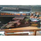 Shelf of vintage scalextrics items includes mini cars etc.