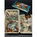 Small basket of costume jewellery to include brooches, necklaces and watch. Together with a